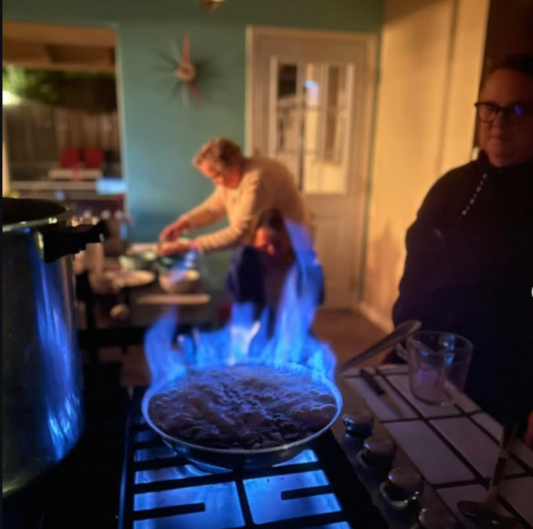 Bill and Flora making Bananas Foster at home · Diane watching · Los Altos