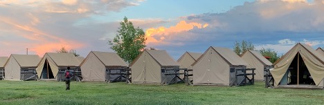 PTC canvas tents · Tooth of Time on the horizon