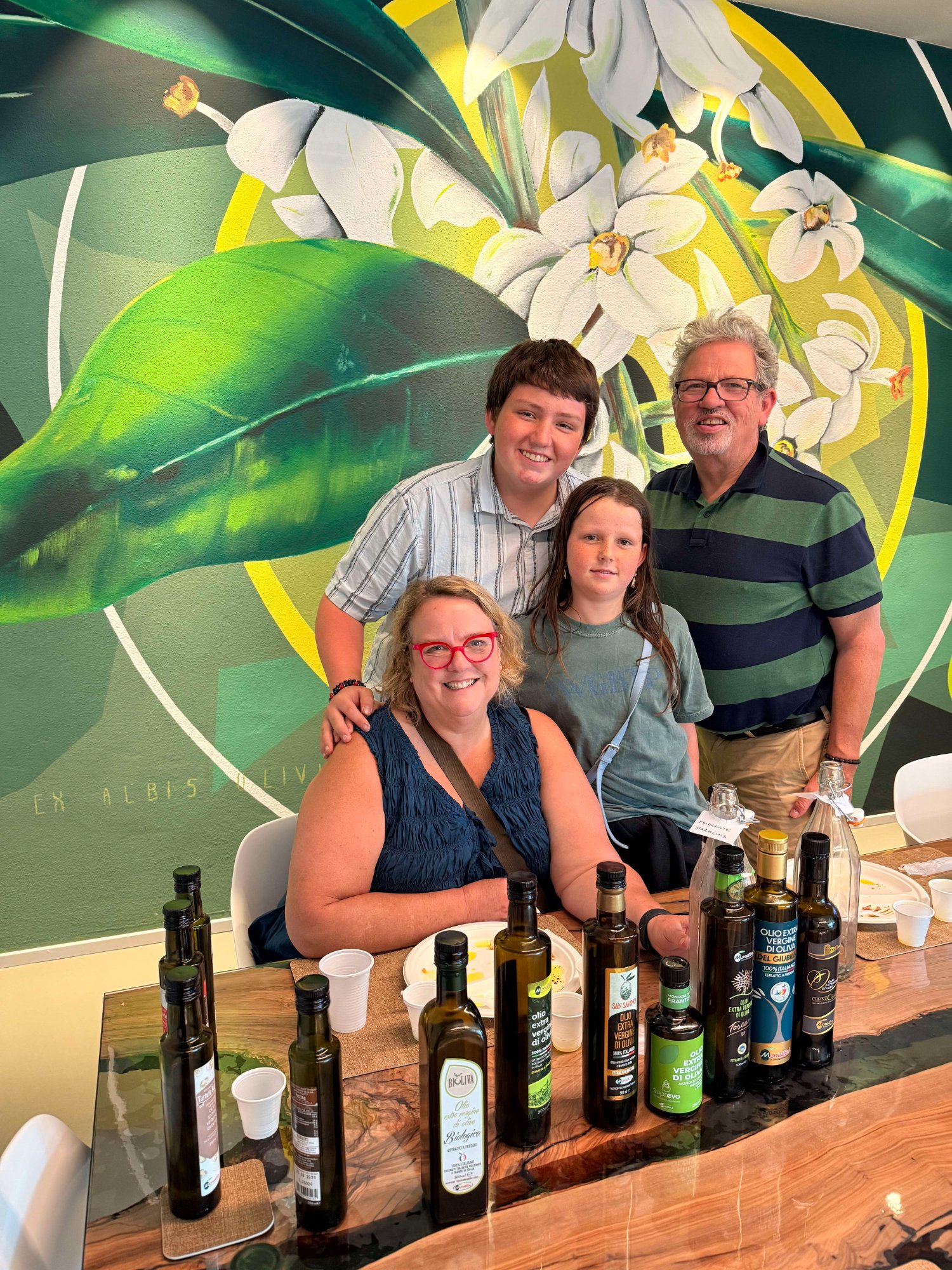 Flora, Bill, Mark and Ellie at an olive oil tasting in Italy