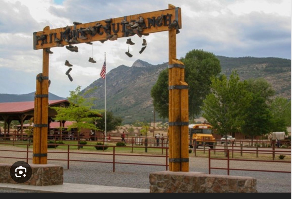 Philmont Welcome Gate · boots overhead · American flag · Tooth of Time